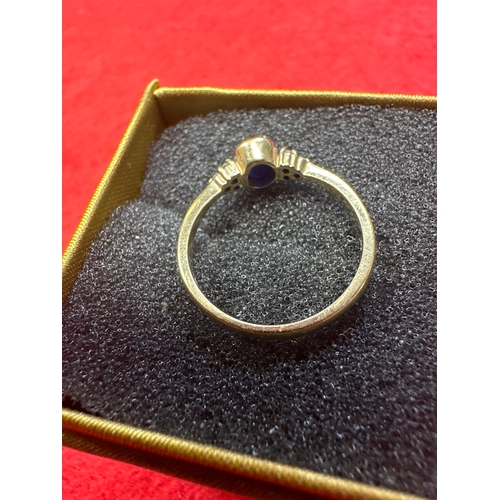 32 - Ladies 9 ct Gold Ring with sapphire and 6 small Diamonds size N