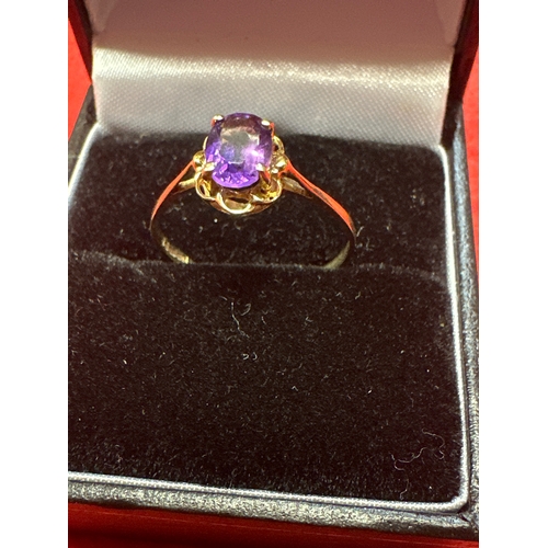 33 - Ladies 9ct Ring with purple stone size P