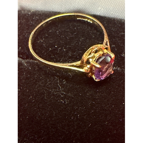 33 - Ladies 9ct Ring with purple stone size P