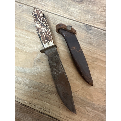 75 - Collectable vintage knife with plastic Stag handle and sheath