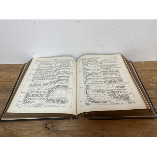 77 - Pair of antique Welsh bibles.