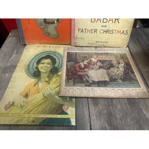 79 - Two 1940s Barbar children’s books a vintage calendar and a tin picture