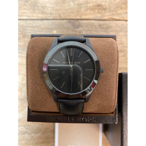 100 - Michael Kors Black Wristwatch with Leather Strap and Box, working order