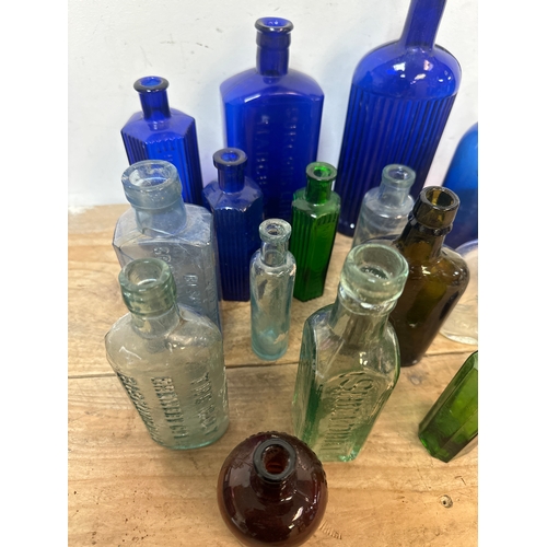 117 - Collection of 18 antique glass bottles