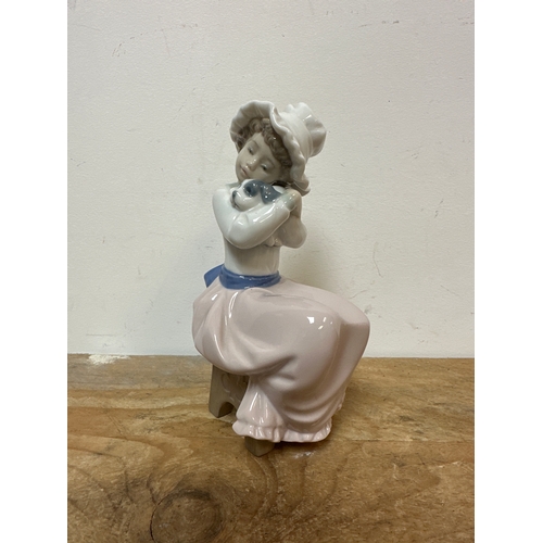 201 - NAO girl figurine seated with a dog