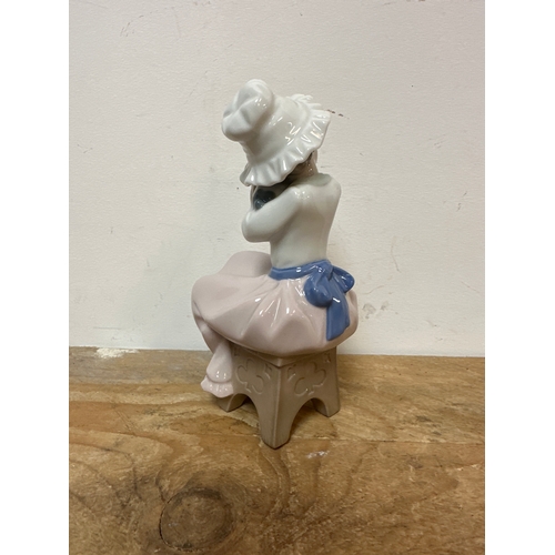 201 - NAO girl figurine seated with a dog