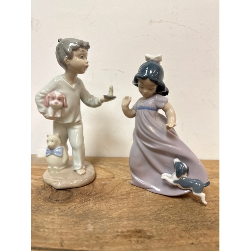 203 - NAO figurines of a boy and gir