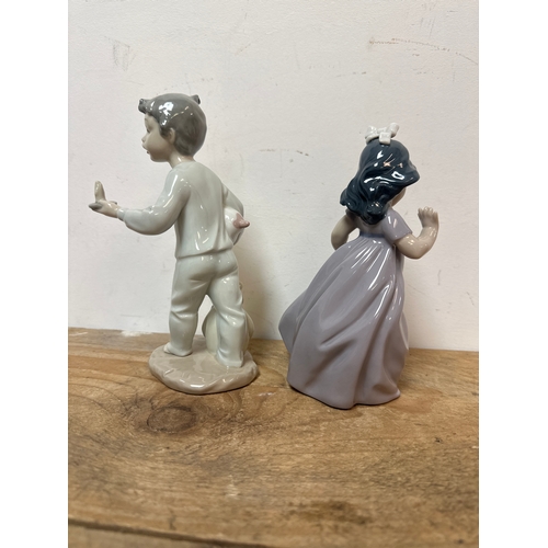 203 - NAO figurines of a boy and gir