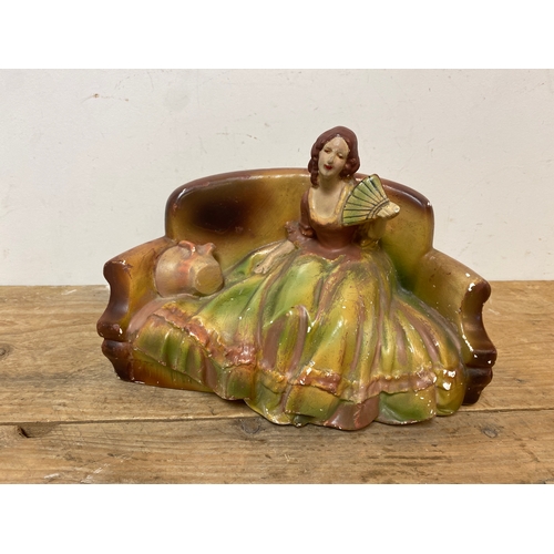 62 - Chalk ware Lady on a Sofa