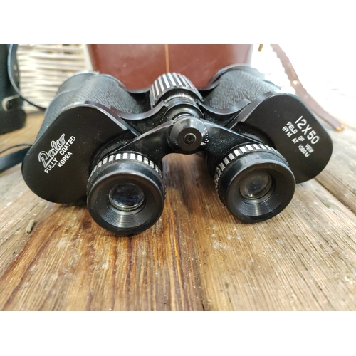 109 - 2X Binoculars Hanimax 10 X 50 Coated Including Carry Case and 12 X 50 Coated Palar Including Carry C... 