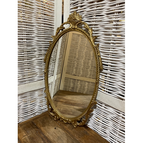 48 - Gilt Framed Oval Mirror. App 20” high