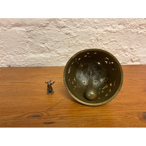 134 - Miniature Disney ratatouille figure together with heavy brass decorative bell