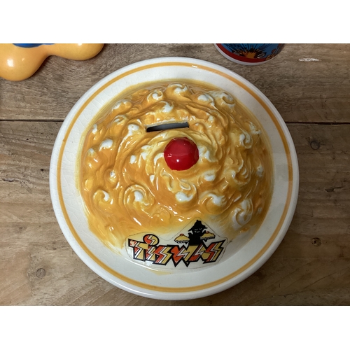 26 - TV Collectables to include Tiswas Phantom Flan Flinger Pie 1980 Moneybox, Mickey Mouse Bottle, Tots ... 