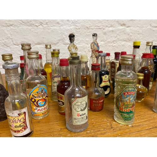 32 - Large Quantity of Vintage Liquor Bottles