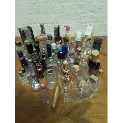 49 - Large collection of perfume bottles all different shapes and sizes.