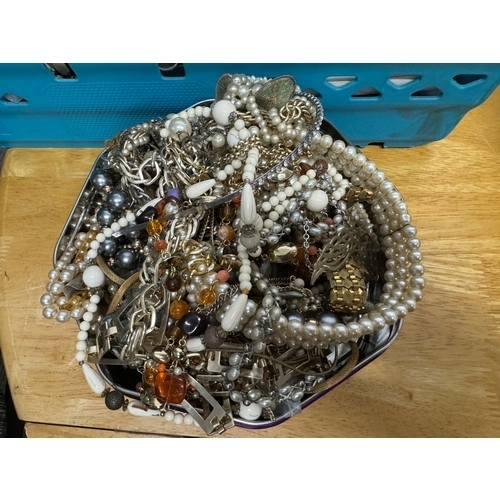 192 - *Large tin of costume jewelry