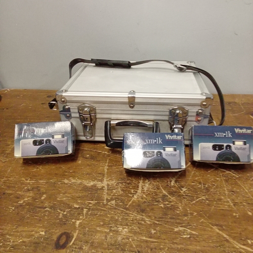 Metal camera box and 3 disposable cameras.