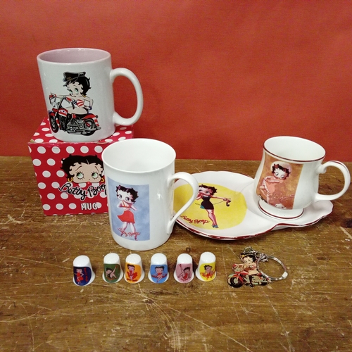 A 2002 King Features Syndicate figure of Betty Boop sat on a chair holding a tray aloft, height 59cm. | Adam Partridge