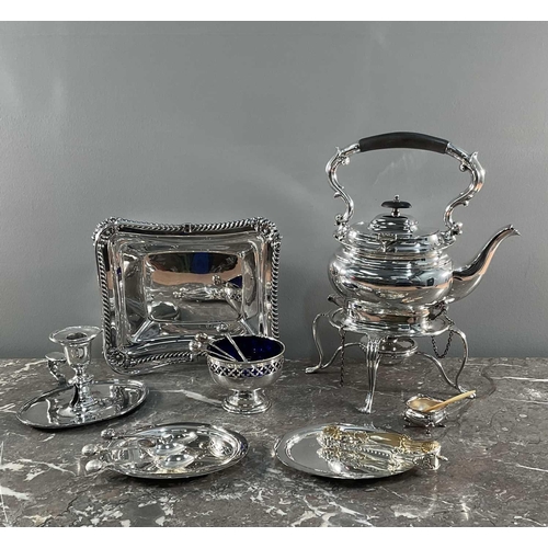 1326 - A quantity of silver-plated items, to include a spirit kettle on stand, a chamber stick, spoons, dis... 