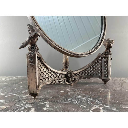 1231 - A 20th century dressing table mirror having carved decoration featuring birds and latticework.Qty: (... 