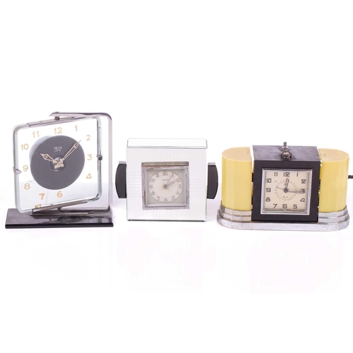 1234 - A vintage Smiths 'mystery' style Art Deco rotating glass and chromium plated electric mantle clock, ... 