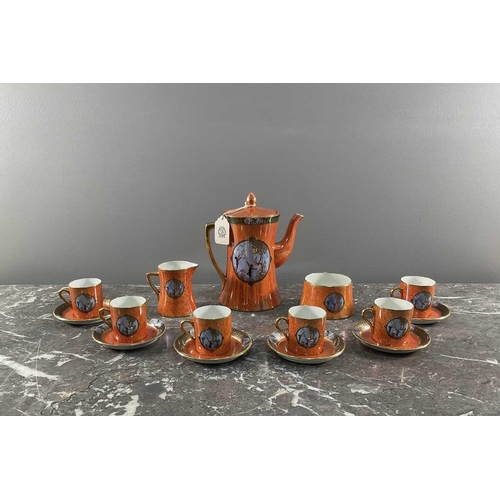 1245 - A Carltonware tea set comprising nine peices, having orange ground with sky blue motifs and lustre g... 