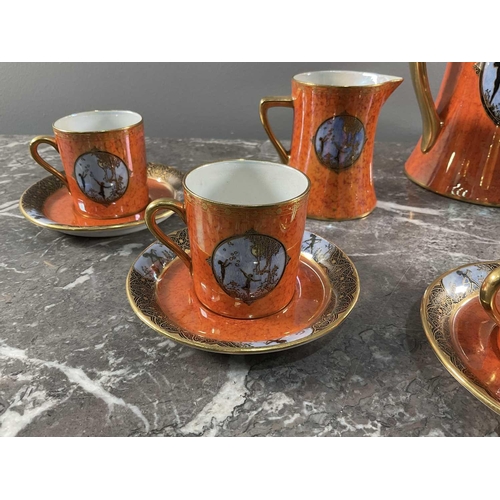 1245 - A Carltonware tea set comprising nine peices, having orange ground with sky blue motifs and lustre g... 