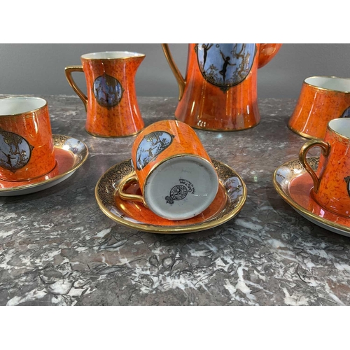 1245 - A Carltonware tea set comprising nine peices, having orange ground with sky blue motifs and lustre g... 