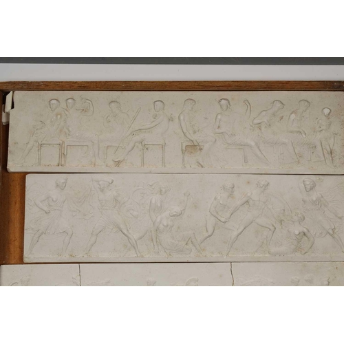 1255 - A collection of white plaster relief panels, late 19th or early 20th century, relief decorated with ... 