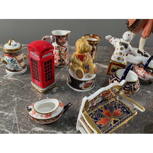 1262 - A collection of Royal Crown Derby ceramic minatures, all signed to bases, together with a Coalport '... 