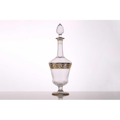 1271 - A 1961 St Louis Thistle pattern crystal decanter and stopper, with gilt decoration on a circular foo... 