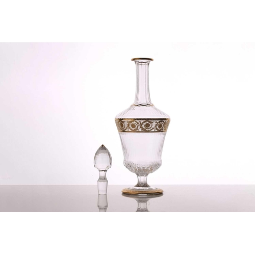 1271 - A 1961 St Louis Thistle pattern crystal decanter and stopper, with gilt decoration on a circular foo... 