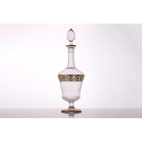 1271 - A 1961 St Louis Thistle pattern crystal decanter and stopper, with gilt decoration on a circular foo... 