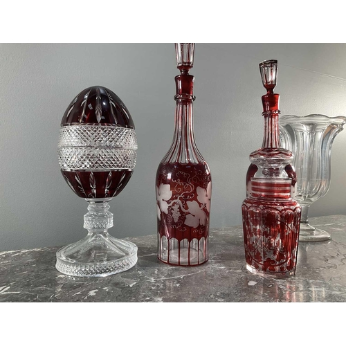 1276 - A collection of five pieces of glass comprising a pair of decanters, an egg shaped jar, a vase and a... 