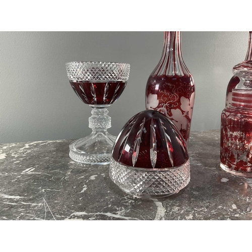 1276 - A collection of five pieces of glass comprising a pair of decanters, an egg shaped jar, a vase and a... 