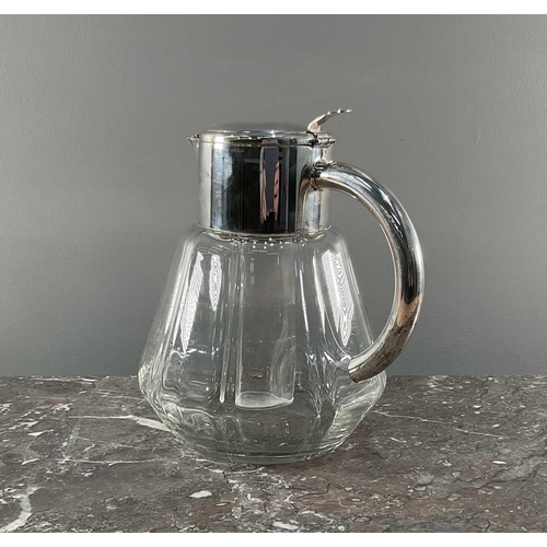 1278 - A 1950s jug officially licenced by Pimms, having silver tone handle and lid with glass insert and si... 