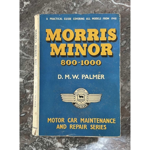 1295 - A collection of vintage car manuals and badges comprising the Mini Handbook, Ford Consul Zephyr Six ... 