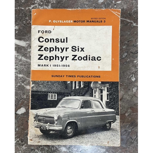 1295 - A collection of vintage car manuals and badges comprising the Mini Handbook, Ford Consul Zephyr Six ... 