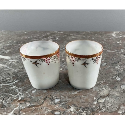 1321 - A pair of Japanese coffee cups in white metal mounts, possibly from Yokohama, the cups having floral... 