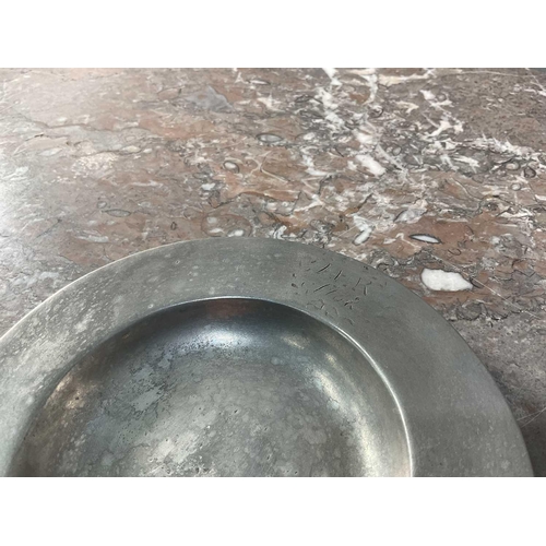 1231 - La Bottega Del Peltro; a large collection of Italian pewter tableware of varying sizes, the smallest... 