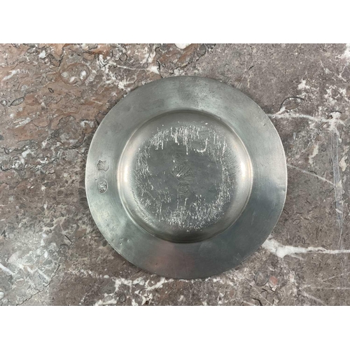 1231 - La Bottega Del Peltro; a large collection of Italian pewter tableware of varying sizes, the smallest... 