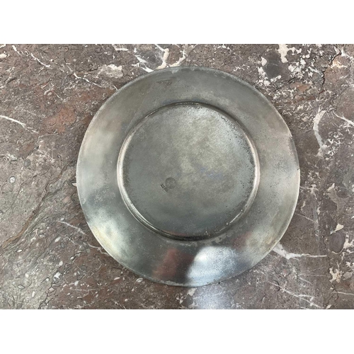 1231 - La Bottega Del Peltro; a large collection of Italian pewter tableware of varying sizes, the smallest... 