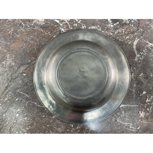 1231 - La Bottega Del Peltro; a large collection of Italian pewter tableware of varying sizes, the smallest... 