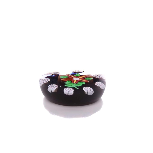 4 - Paul Ysart (?), (1904-1991), a red and yellow flower paperweight surrounded by intricate canes, unsi... 