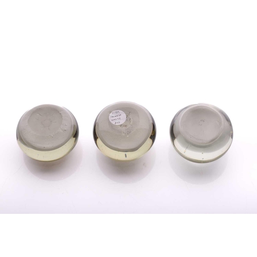 40 - A collection of three 'Chinese White' paperweights featuring landscape scenes of varying seasons, al... 