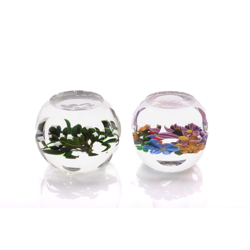47 - Perthshire Paperweights; two faceted flower pattern paperweights, one having a white lampwork bouque... 