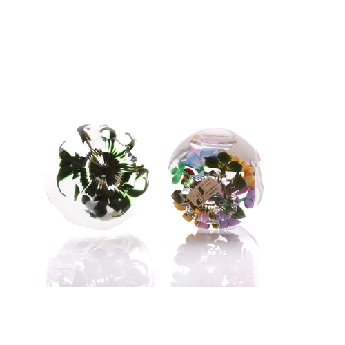 47 - Perthshire Paperweights; two faceted flower pattern paperweights, one having a white lampwork bouque... 