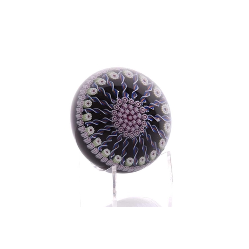 49 - Perthshire Paperweights; a collection of four weights comprising two with complex milifiori designs ... 