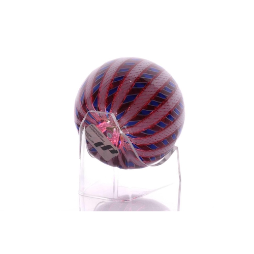 49 - Perthshire Paperweights; a collection of four weights comprising two with complex milifiori designs ... 