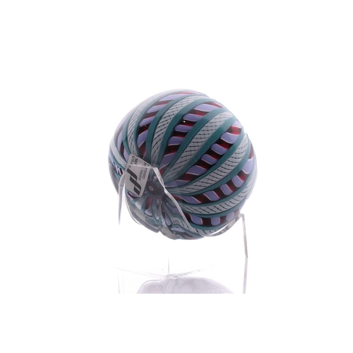 49 - Perthshire Paperweights; a collection of four weights comprising two with complex milifiori designs ... 